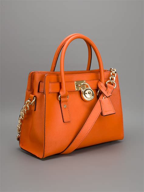 michael kors orange bag spikes|Michael Kors orange handbags.